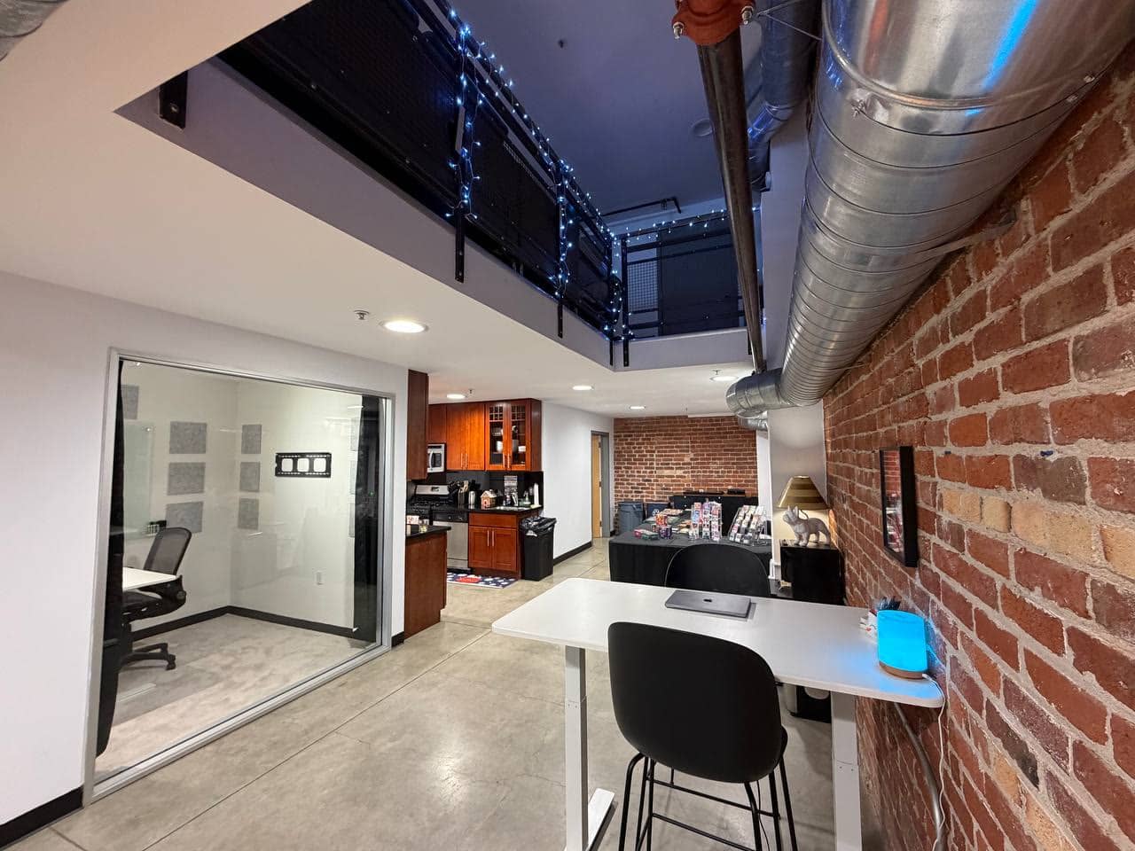The kitchen counter and glass meeting room