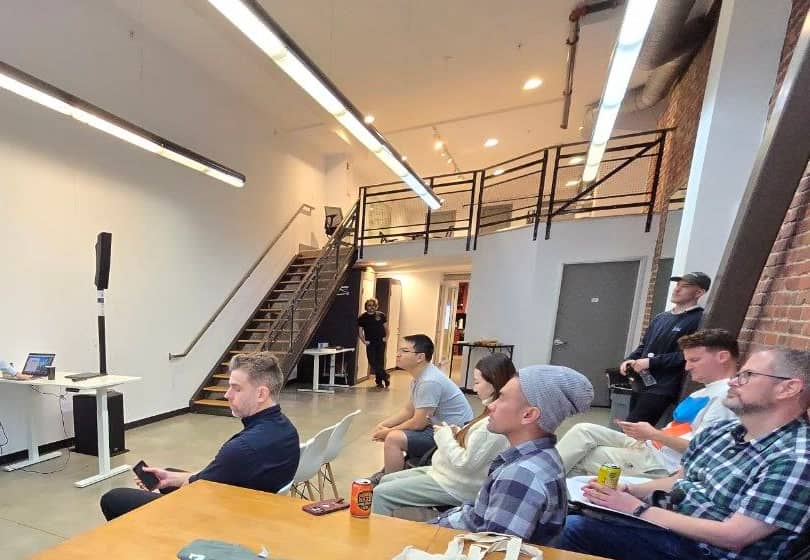 The audience at a talk on the office floor